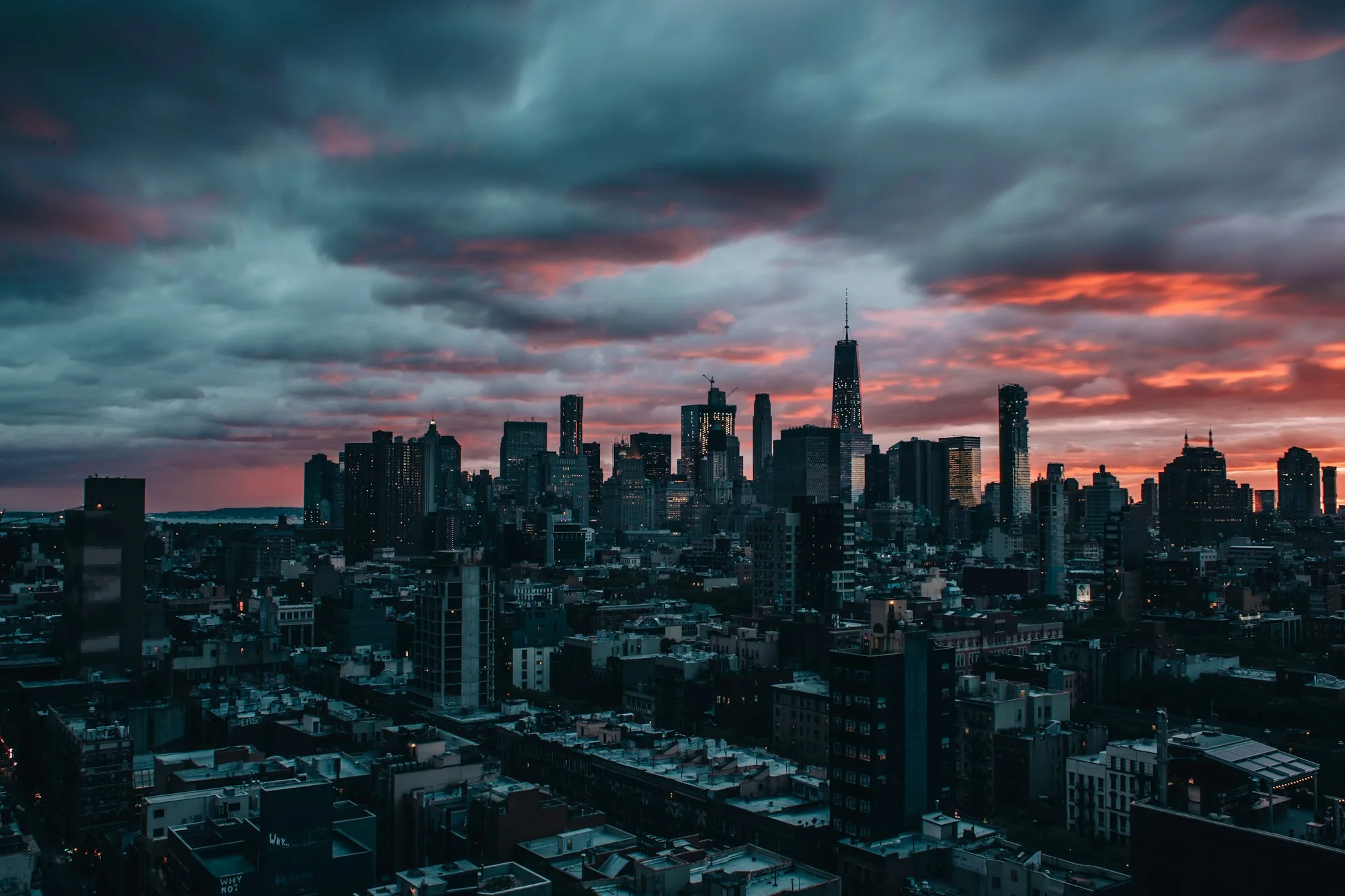 A city skyline beneath dramatic evening clouds